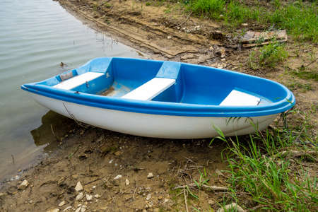 Boat on the lake shoreの写真素材