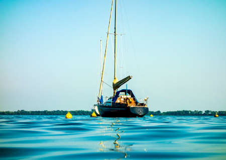 Sailboat moored in the harbor for boats, yachts and sailboats in a recreational destinationの写真素材