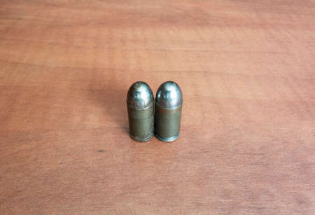 Pistol bullets, the left one is old corroded and the right one is new