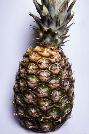 Fresh and ripe pineapple on a white backgroundの写真素材