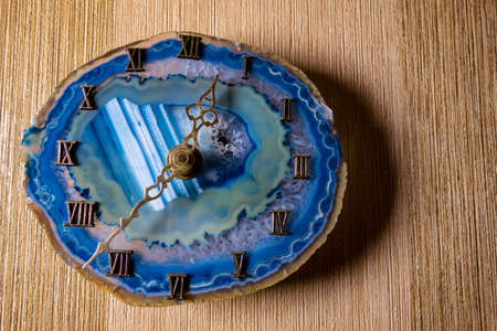 Wall clock made of opal