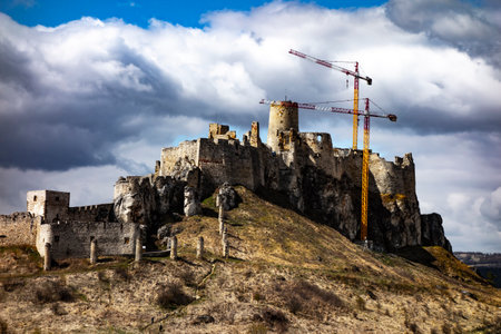 Reconstruction work on the SpiÅ¡ castle with high cranesの写真素材
