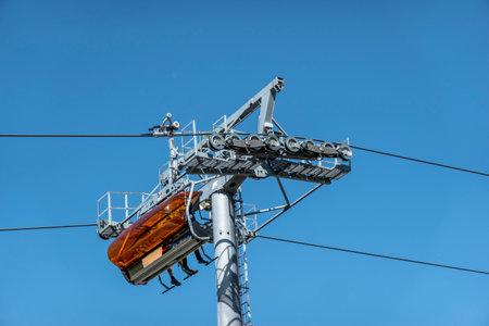 Chair lift for tourists and skiers in the High Tatras, rocky lakeの写真素材