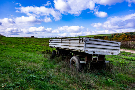 Parked car trailer in autumn natureの写真素材