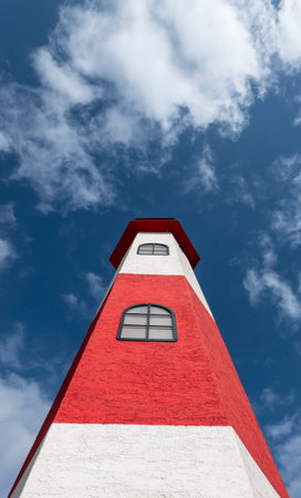 Lighthouse on the shores of the lake harborの写真素材