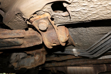 A view of the chassis of an old corroded twenty year old carの写真素材