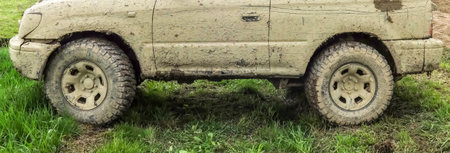 Off-road car in muddy terrain