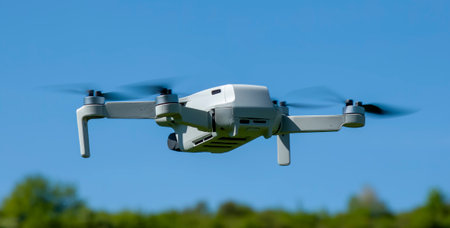Remotely controlled drone with camera system in full operation