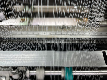 Industrial knitting machine for knitting textile fabrics