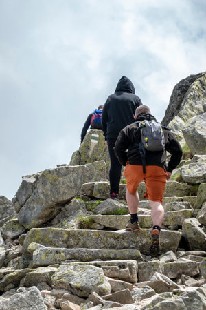 Tourists vacationing on top of a mountain