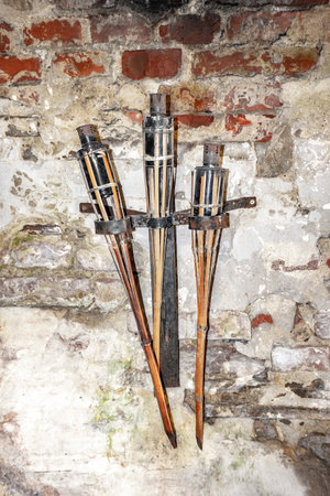 Ancient torch on the wall in the interior of the historic castle