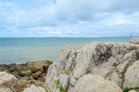 The rocks along the shoreline on the beachの写真素材