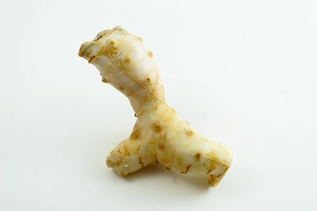 Galangal oil in isolated white backgroundの写真素材