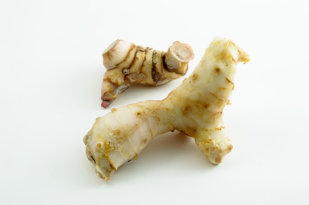 Galangal oil in isolated white backgroundの写真素材