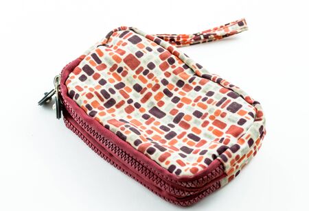 Colorful coins purse with zip on white backgroundの写真素材