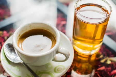 Coffee and tea on glass table.の写真素材