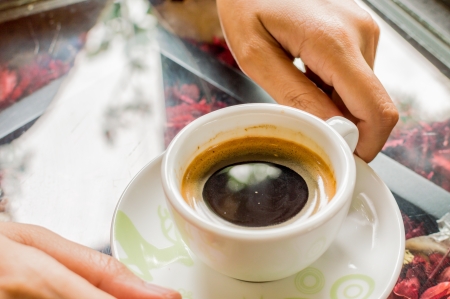 Woman hands with cup of coffee の写真素材