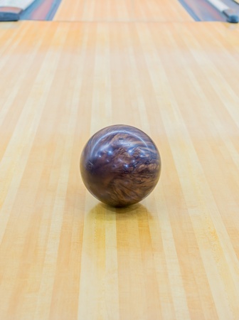 Brown bowling ball with Bowling alley.の写真素材
