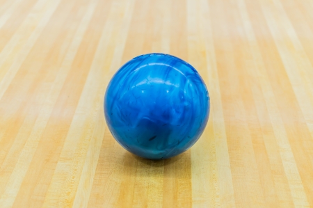 Blue bowling ball with Bowling alley.の写真素材
