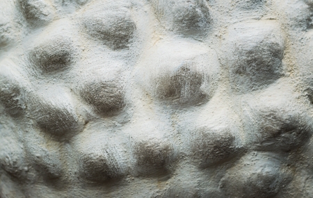 Embossed stone seamless background.