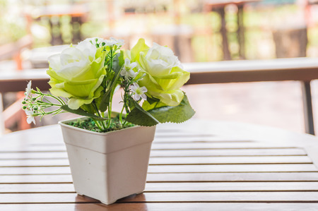Beautiful flowers on wooden table brown.の写真素材