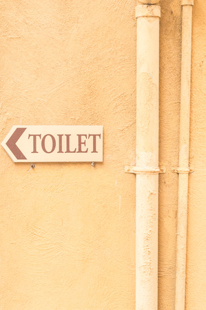 Turn left and go to the toilet signsの写真素材