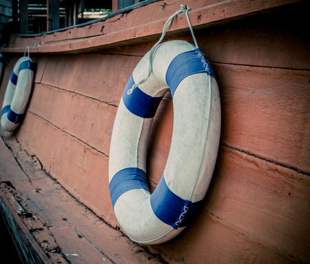 lifebuoy blue stripes. attached to side of the ship. readily available.の写真素材
