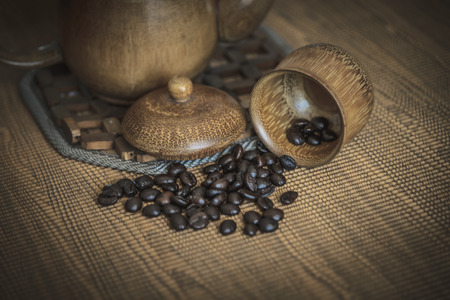Vintage photo of coffee beans and Coffee cups set on wooden background.Vintage style.の写真素材
