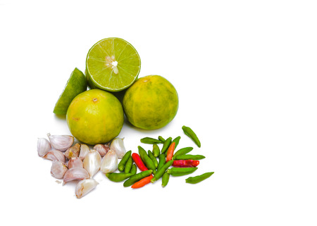 Chili peppers, garlic and lime on white background. Asian ingredients foodの写真素材