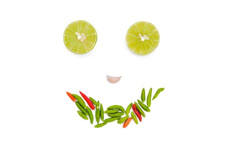 Chili peppers, garlic and lime on white background. Asian ingredients foodの写真素材