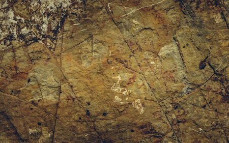 Close up texture of grunge cracked old stone wall.