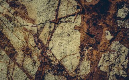 Close up texture of grunge cracked old stone wall.
