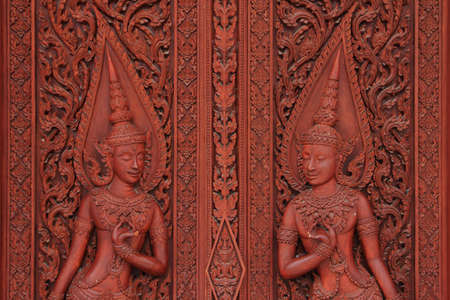 Wood carving temple door in Thailandの写真素材