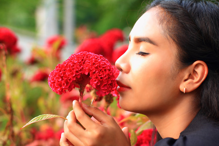 woman with flowers in gardenの写真素材