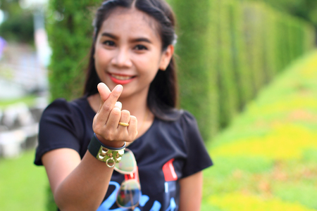 women with hand symbol little heartの写真素材