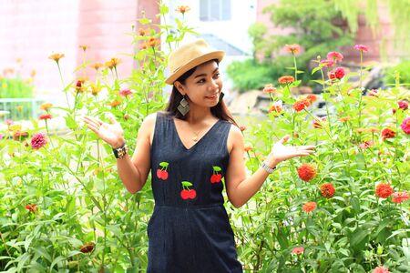 woman with flowers in gardenの写真素材