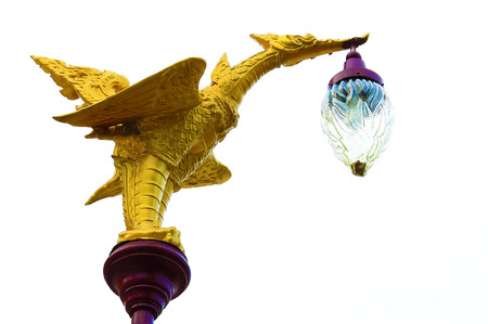 swan sculpture lamp decorate on the top pole isolated white backgroundの写真素材