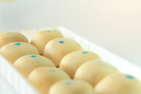 clipping paths with close up group mochi dessert in dish isolated on white background,moji dessert sweet for eating with coffee or tea,breakfast healthy food eat with a drinkの写真素材