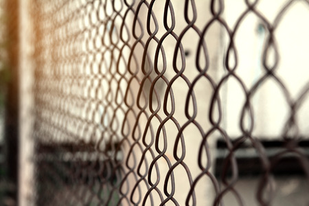 freedom concept background,close up of a fence made of metal wire grids with rusty,restricted area securityの写真素材