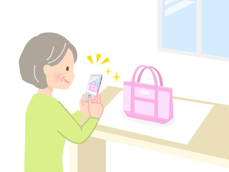 Senior woman photographing bag with smartphoneのイラスト素材