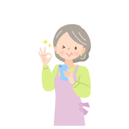 Middle-aged woman in apron looking at smartphone screen and signing OKのイラスト素材