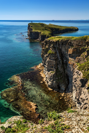 rocky coastline of the island near Vladivostok in early autumnの写真素材