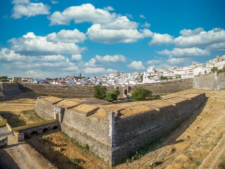 Elements of a fortification: aerial view of a triangle share ravelin or demi lune with a sentry box in the ditch between 2 bastions in Elvas Portugal, the structure adds additional defense to the gateの写真素材