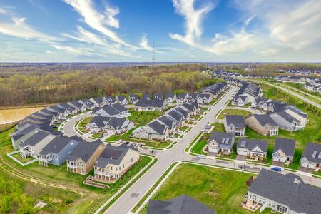 Aerial view of the geometrical curving American residential neighborhood, single family houses built...