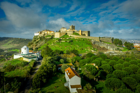 Aerial panorama view of Palmela castle pousada with stunning blue sky and old wind mills near Setubal Portugalのeditorial素材