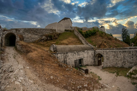 Tesanj castle from the Ottoman period with fortified gate, cannot tower with dramatic sky in Bosnia Herzegovinaのeditorial素材