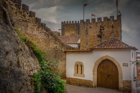 View of Obidos castle and walled medieval town in Central Portugal one of the seven wonders of Portugal with a pousada luxury hotel popular tourist destinationのeditorial素材