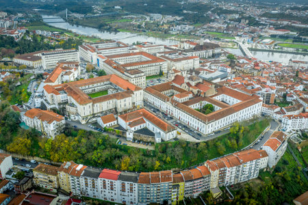 Aerial panoramic sunset view of Coimbra Portugal with the ancient university , Mondego river, Santa Clara, Isabel, pedestrian bridgeのeditorial素材