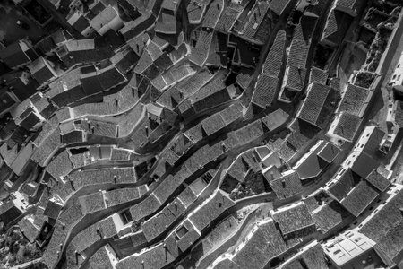 Aerial view of colorful waving, curving rooftops in Alcala del Jucar Albacete Province Spain