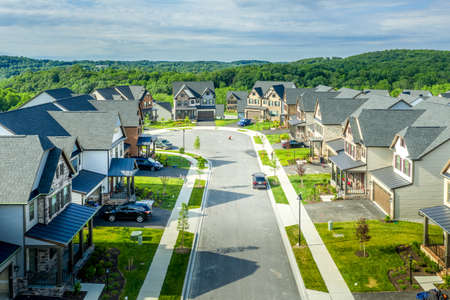 Aerial view of cul de sac street with alps style upper middle class luxury single family homes and cloudy blue sky in Maryland USAの写真素材